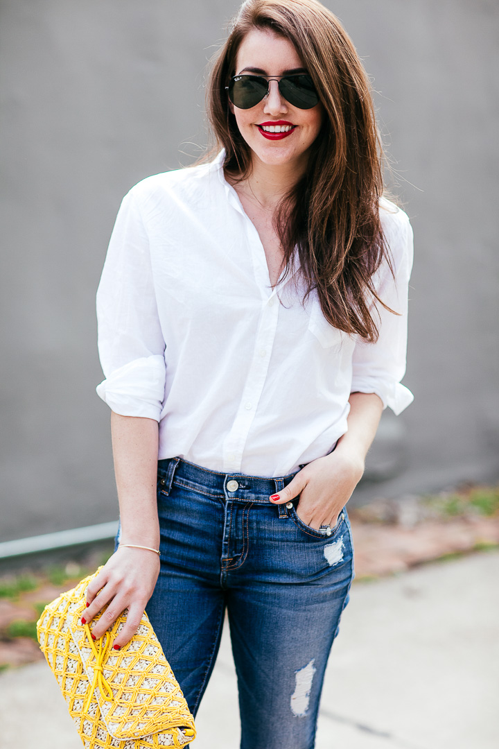 Amy Havins wears ripped 7 for all mankind jeans and a white blouse ...